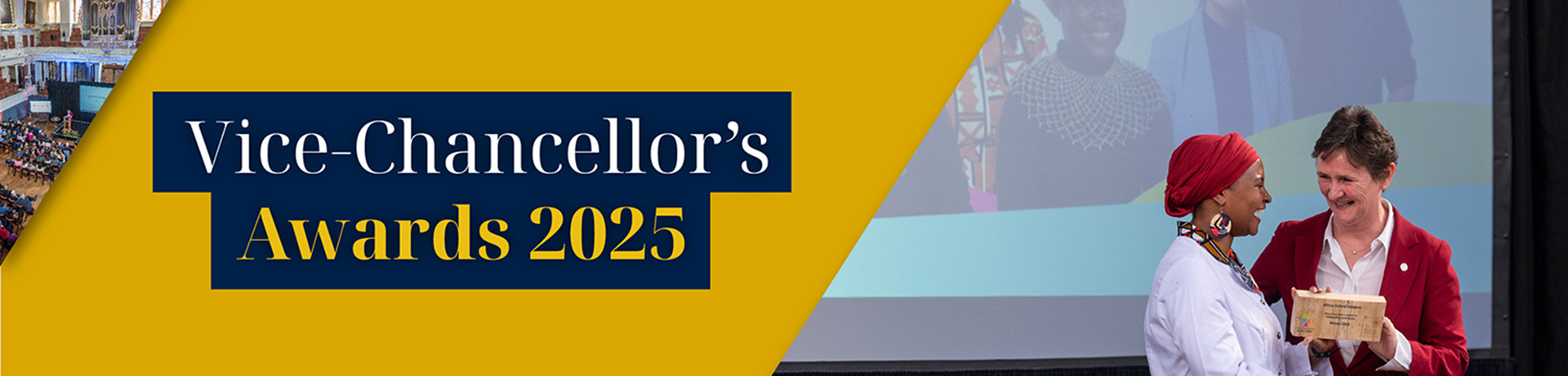 Oxford University's Vice Chancellor wears a red suit, holds a wooden trophy and shakes the hand of an award winner. They stand in front of a screen displaying photographs. 
