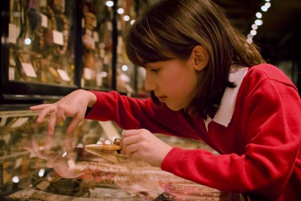 Student participating in education session at the Pitt Rivers Museum
