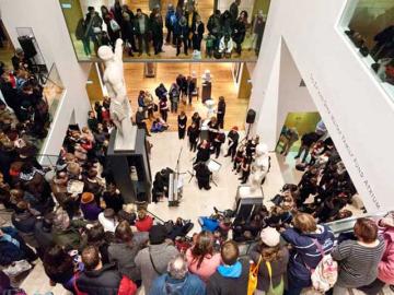 Busy atrium in the Ashmolean Museum during a late night event