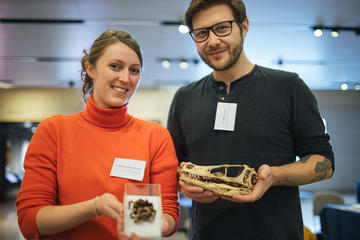 Two participants holding natural history specimens